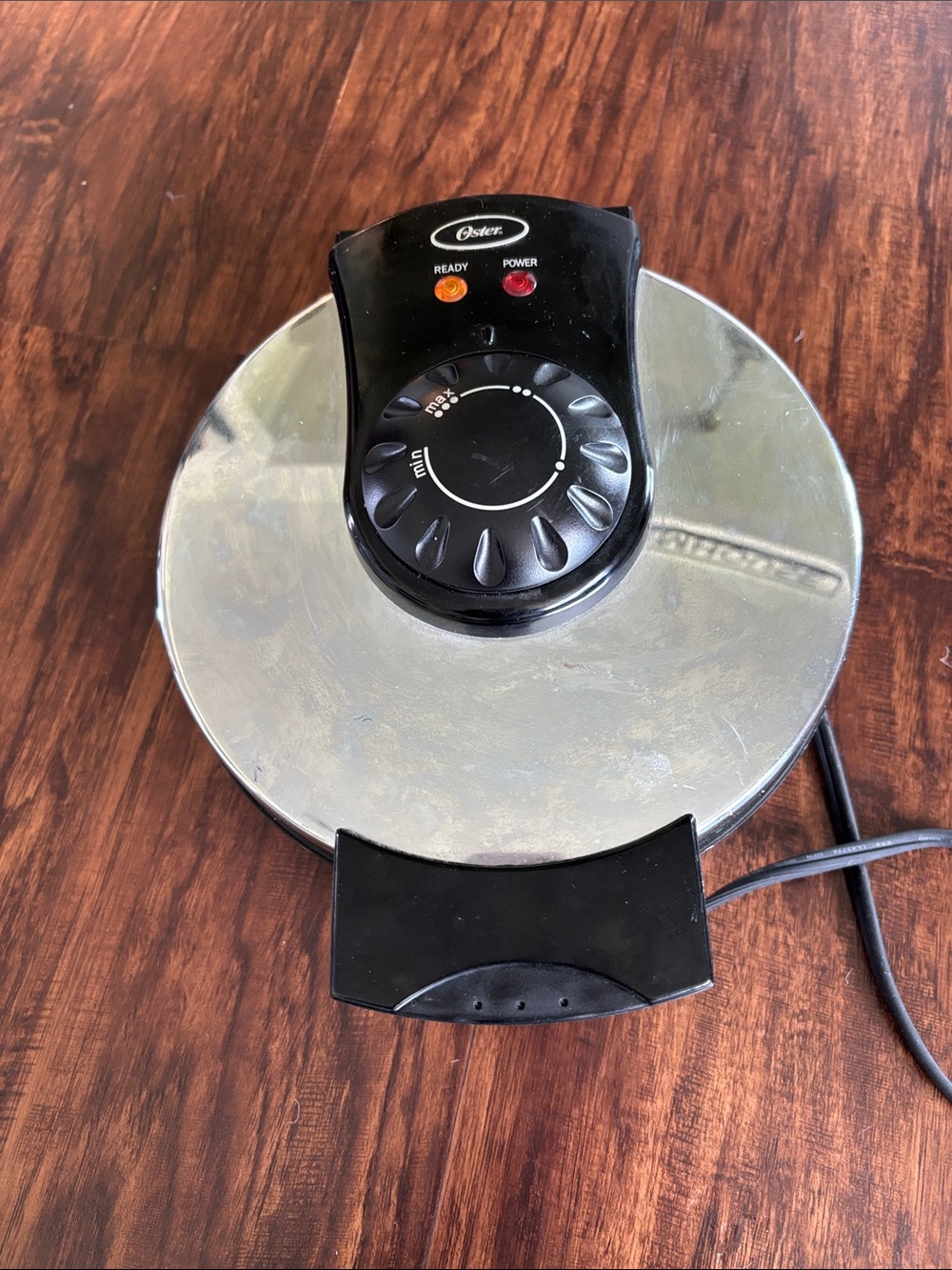Oster Round Waffle Maker in Black and Silver
